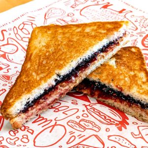Peanut butter and jam on toasted white bread. Served with fries. **contains peanut, egg, dairy, wheat**