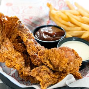 Two breaded chicken tenders served with Live Fire seasoned fries, bbq sauce, and ranch dressing dip. **contains wheat, dairy, egg, soy, fish**
