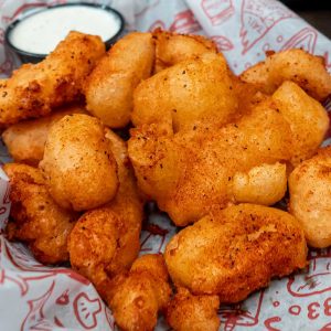 Cheese curds with ranch dressing dip.