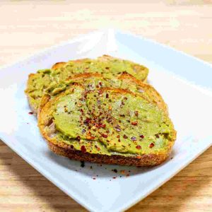 Avocado Toast on Looks Bakehouse Sourdough, with Red Pepper Flakes.