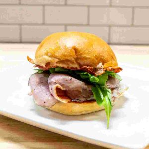 Egg, Canadian Bacon, Arugula, Cheese Crust Blend, Egg, Jalapeno Jam. Served on a Looks Bakehouse Brioche Bun.