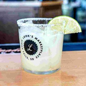 Corazon blanco tequila, orange liqueur, lime, and simple syrup. Served over ice with lime.