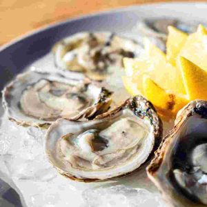 Oysters on the half shell served with seasonal mignonette. *Consuming raw oysters may increase your risk of foodborne illness. 