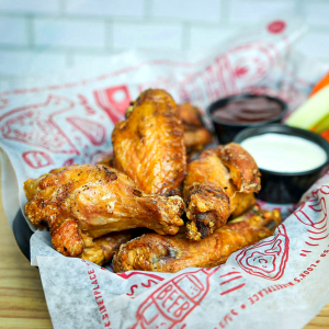 Smoked then fried wings with ranch dressing or blue cheese dressing dip. Choose your flavor. **may contain fish, wheat, dairy, soy, egg** 
