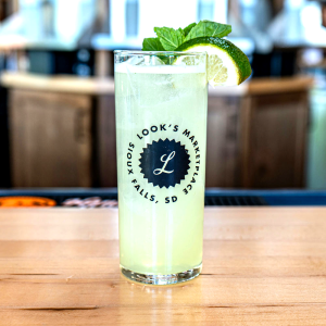 Flor de Caña blanco rum, lime and simple syrup. Garnished with lime and mint.