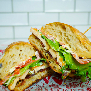 Grilled chicken, house smoked bacon, yellow cheddar, mayonnaise, ranch, lettuce, and tomato on ciabatta. **contains wheat, egg, soy, dairy**
