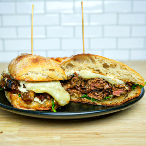 Grilled sirloin steak, Live Fire steak sauce, horseradish cream, mushrooms, caramelized onions, arugula, and cheese blend on ciabatta roll with Live Fire seasoned french fries. **contains soy, egg, dairy, wheat, fish**