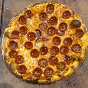 Classic Pepperoni Pizza with Tomato Sauce, Mozzarella Cheese and Ezzo Pepperoni. 