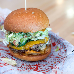 Double smash patty, pepper jack cheese, cheddar cheese, grilled jalapeño, Live Fire chips, guacamole, shredded lettuce, and chili lime mayonnaise on a brioche bun. **contains wheat, egg, dairy, soy, may contain fish**